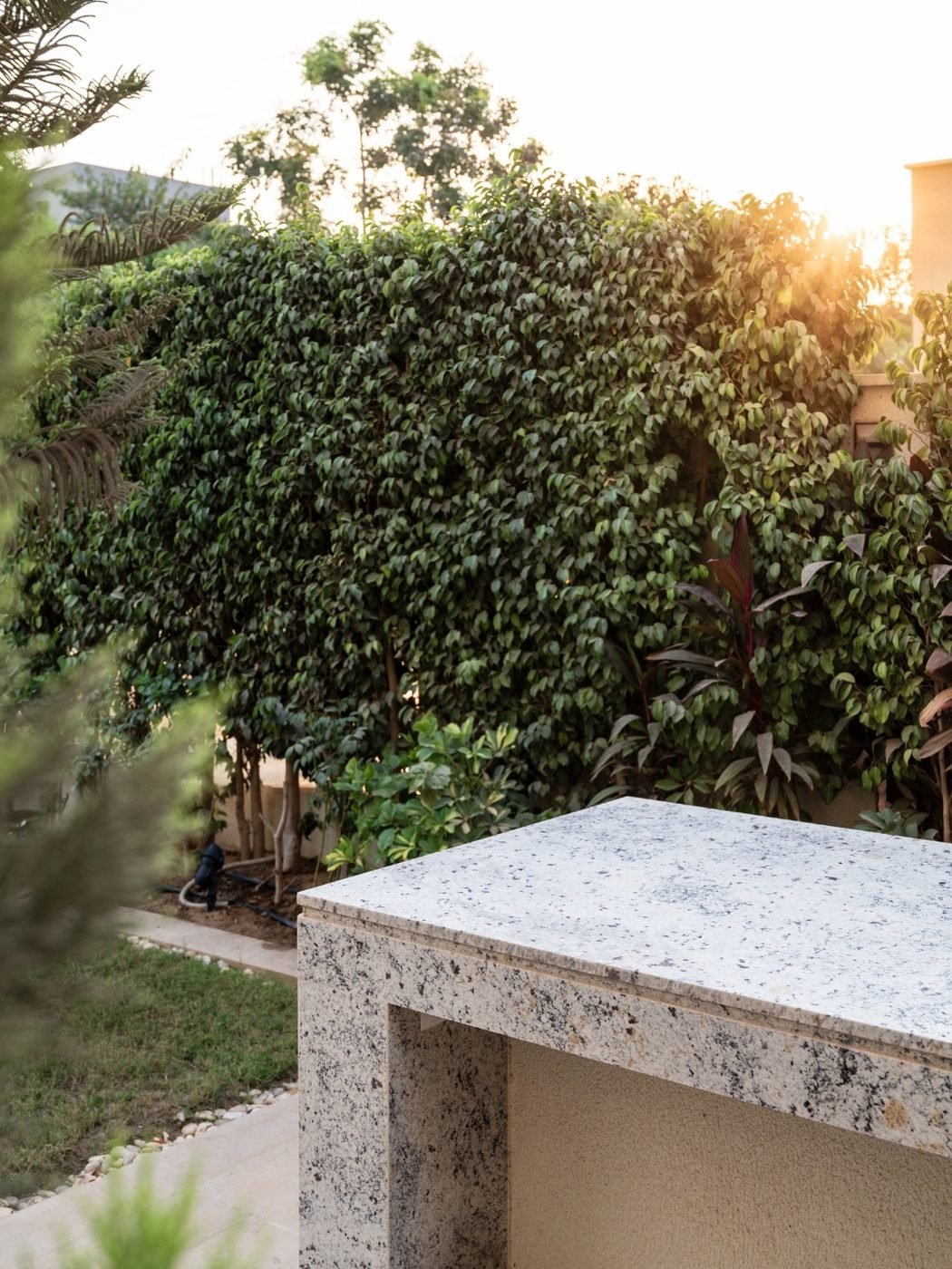 Granite counter in the garden. A stone counter at the edge of the planting