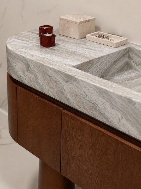 Sage jacarda stone vanity. A sculpted basin in flowing green veining